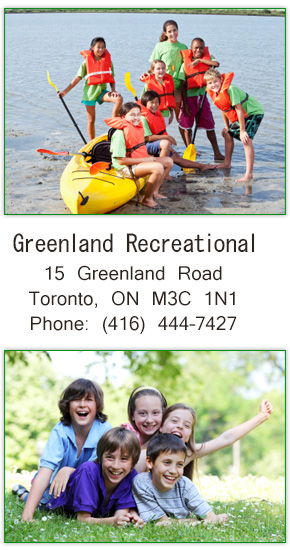 Children around a kayak at the lake
